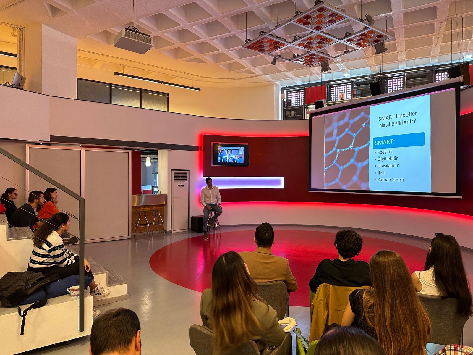 Alican Kaynar giving a talk on setting SMART goals